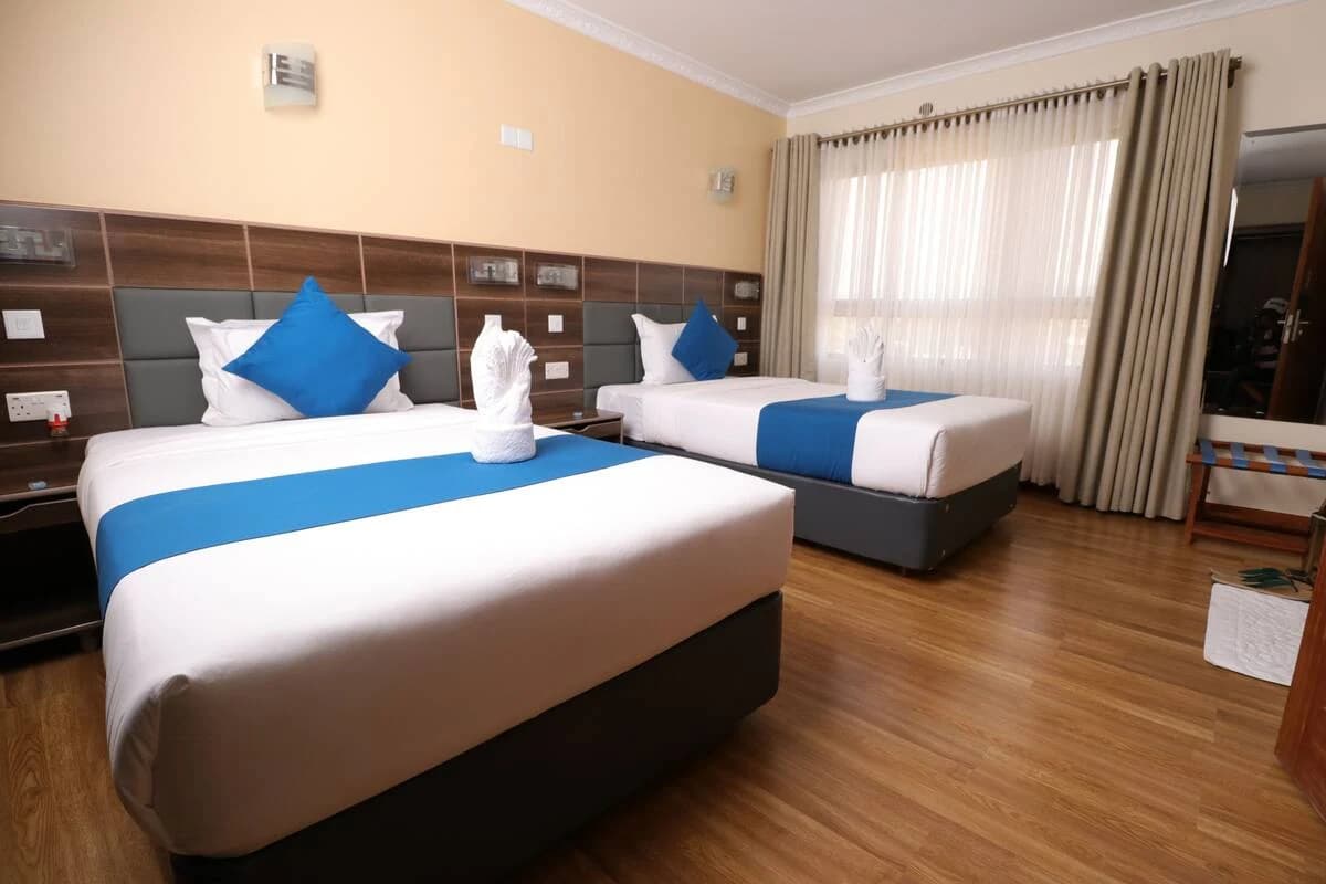 Guest room with two beds at Buraha Zenoni