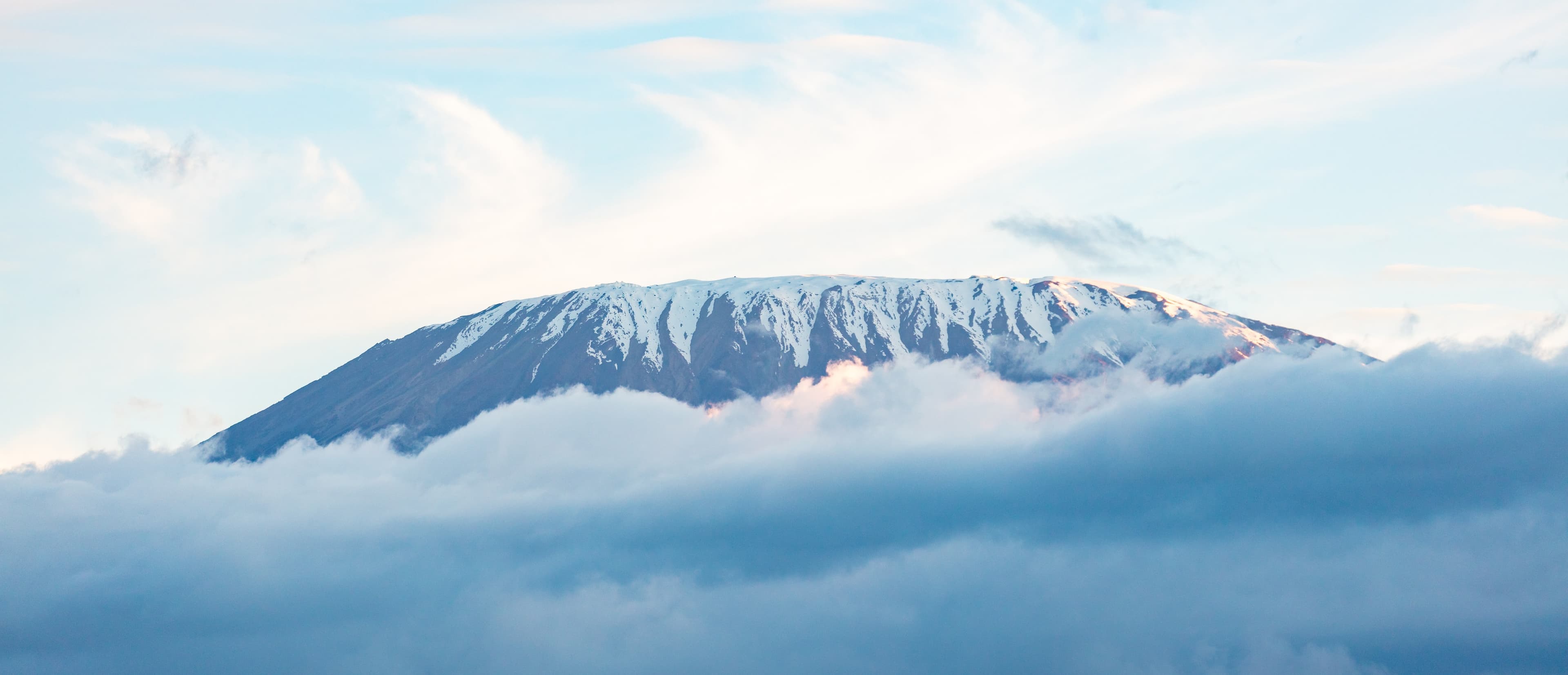 Snow-capped Mount Kilimanjaro seen across the Tanzanian plains